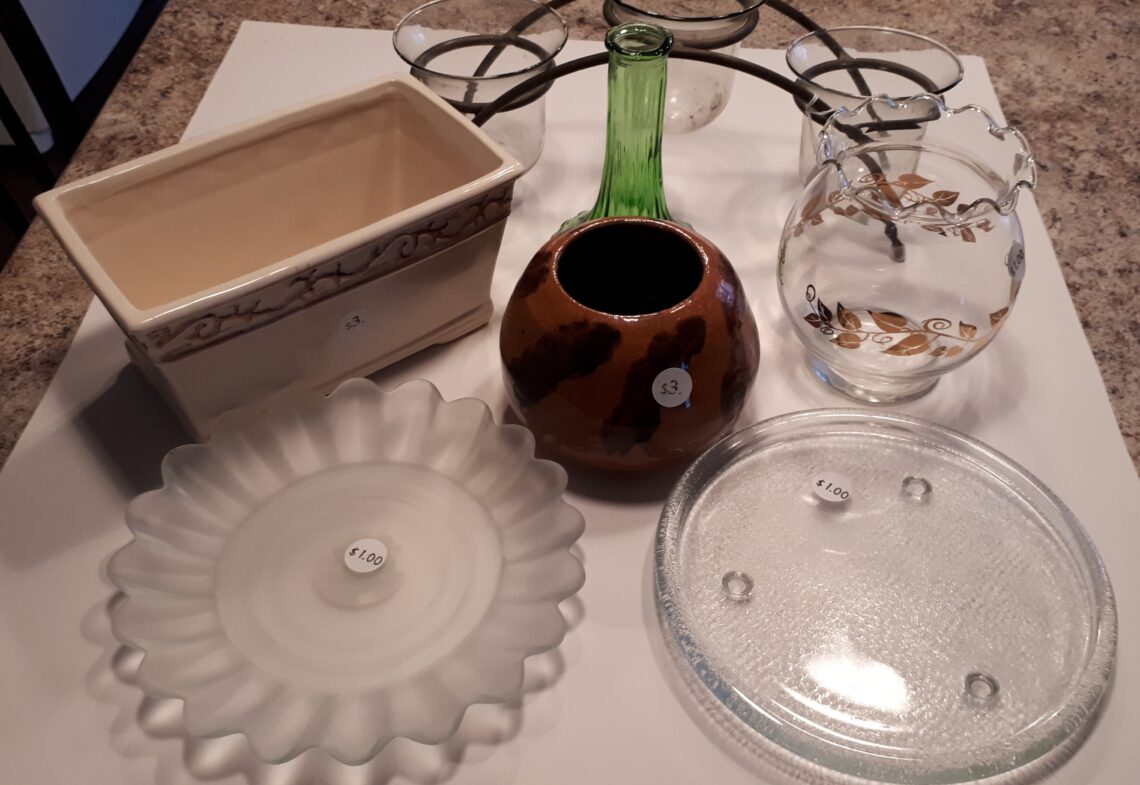 Several container items for plants from the thift store. Vases and plates