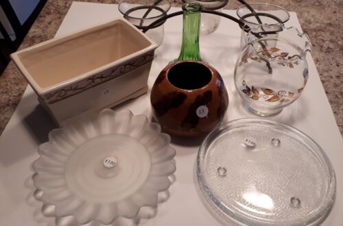 Several container items for plants from the thift store. Vases and plates