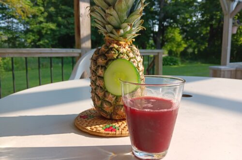 Glass of Zobo with a pineapple al fresco.