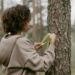 Woman measuring tree trunk. Citizen Scientist