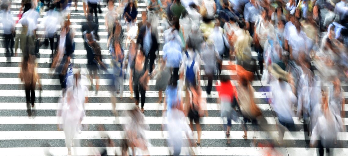 Blurred pedestrians crossing a crosswalk. Pixabay photo