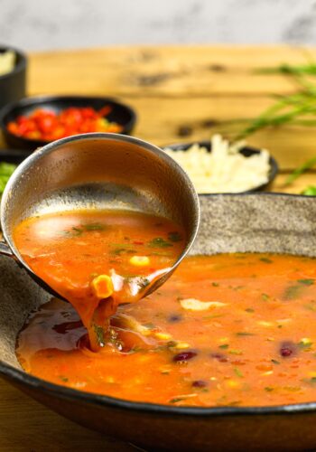 Soup in a bowl with a serving spoon