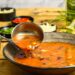 Soup in a bowl with a serving spoon