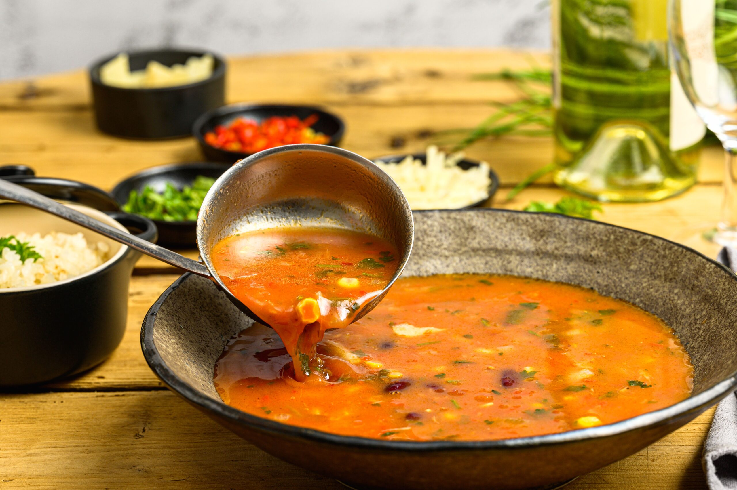 Soup in a bowl with a serving spoon